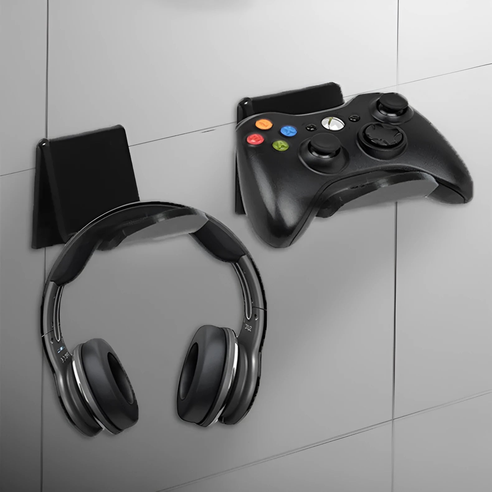 Universal game controller wall bracket in plastic available in black, white and transparent colours
