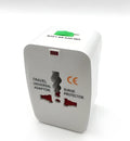 Universal travel adapter plug with multiple sockets on a white background.