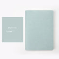 A5 dotted notebook with imitation leather cover in blue or pink colour options showing dot matrix interior pages