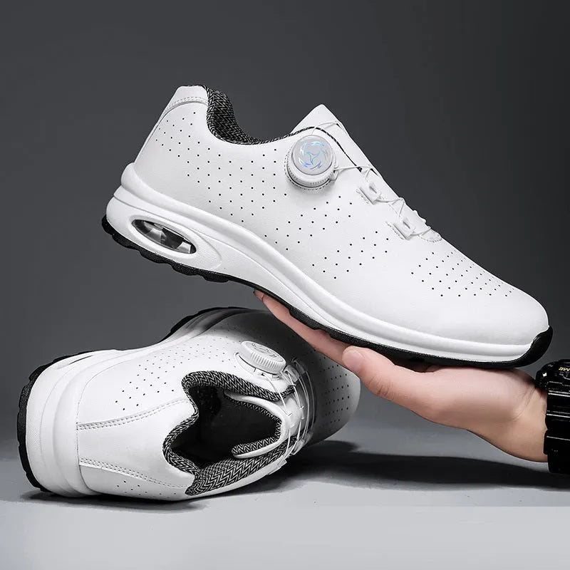 Black and white low-top mesh casual tennis shoes with cross shoulder straps and flat soles.