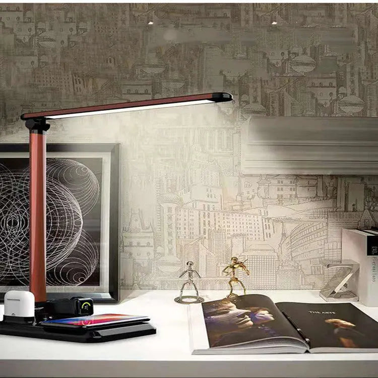 Black and white 4-in-1 LED desk lamp with integrated wireless charging pad and TYPE-C port.