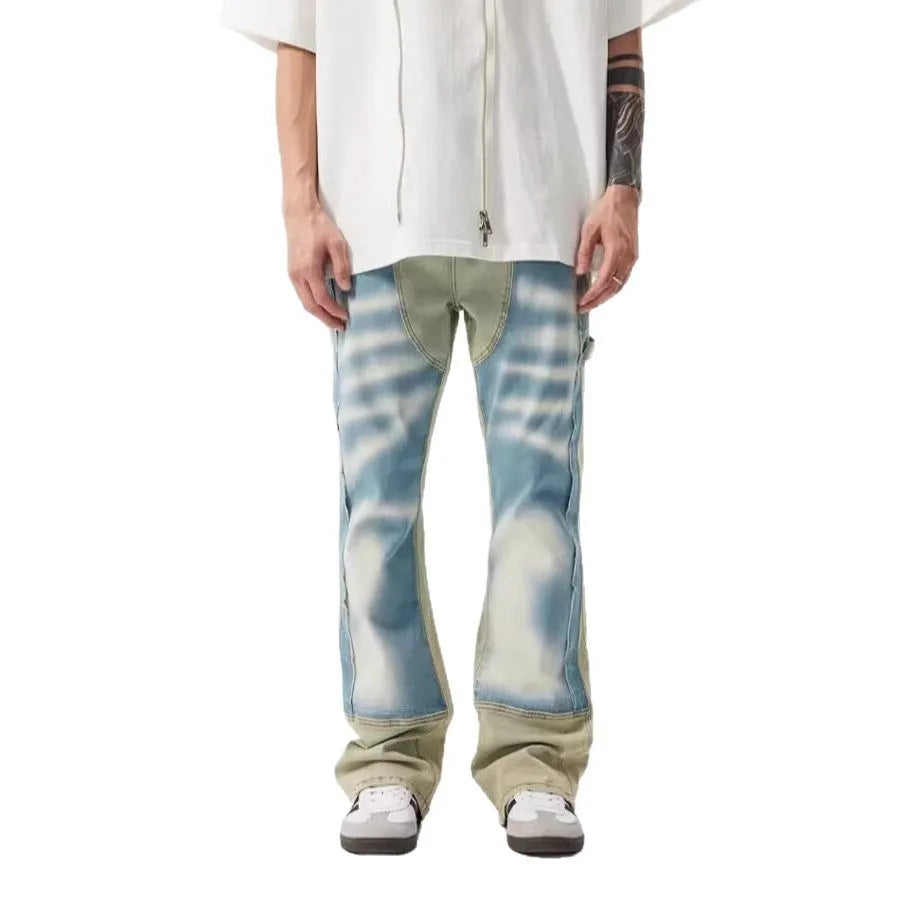 Yellow and blue retro patchwork splash-ink damaged design jeans on a mid-waist fit.