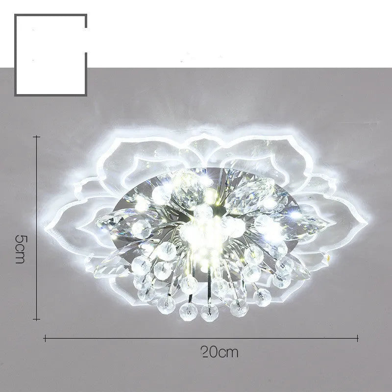 Small modern crystal and acrylic ceiling lamp with stainless steel fitting on a white ceiling.