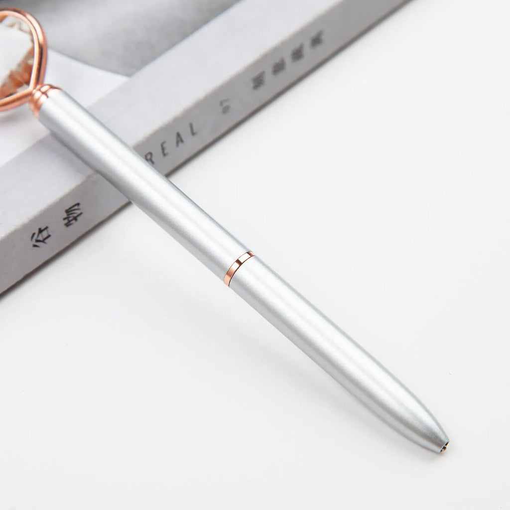 Creative Crystal Love Ball diamond metal pen in rose gold on a white background