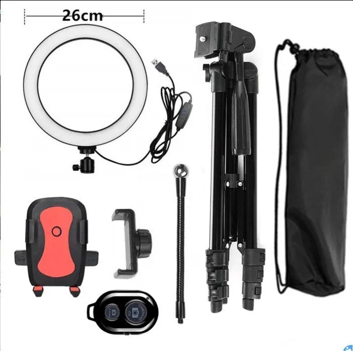 Silver adjustable tripod phone stand extended to mid-height with a ring light attachment point.