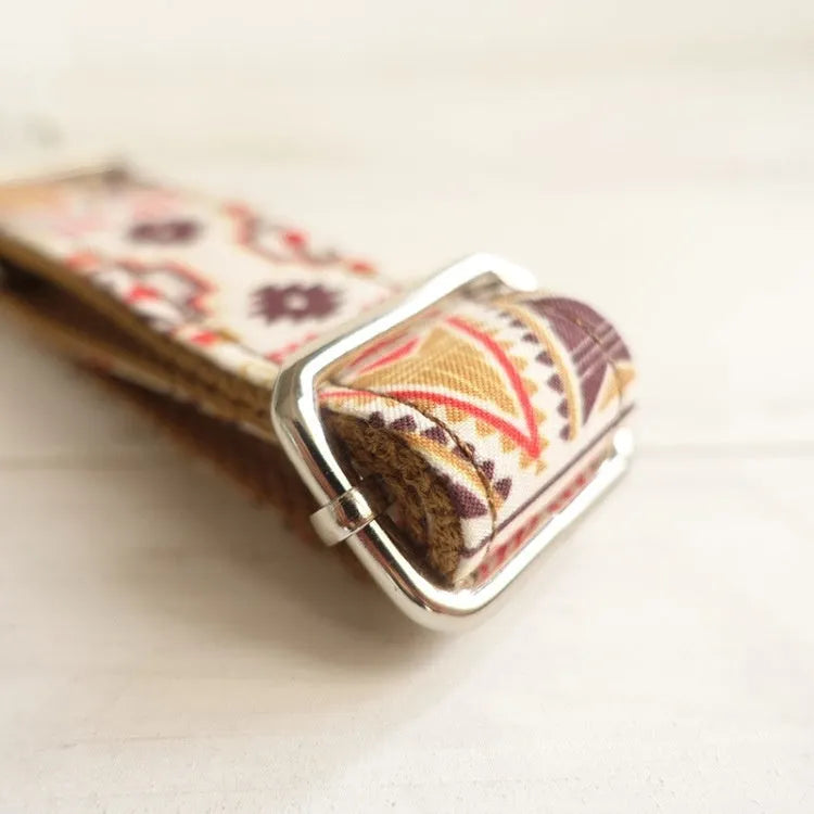 Brown polyester bohemian dog collar on a small dog, adjustable size