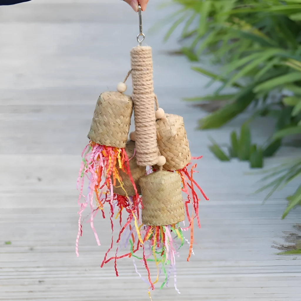 Colourful parrot shredding toy with natural wood and sisal rope measuring 15 by 35 centimetres