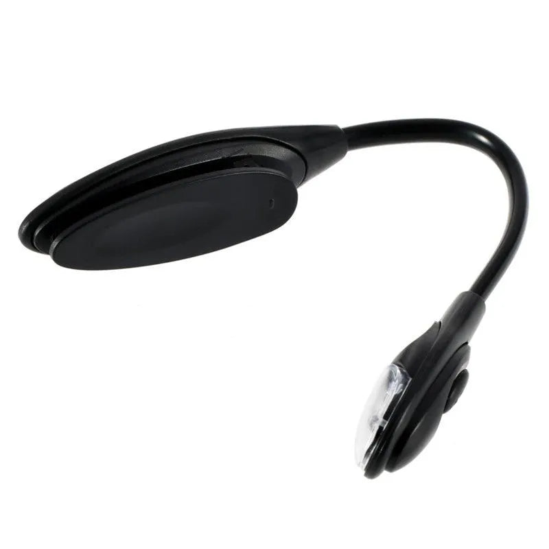 Mini clip-on LED book light with 26cm arm attached to a hardcover book