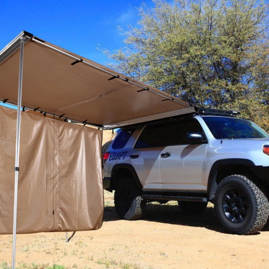 Camouflage two-bedroom camping tent with aluminium poles set up outdoors.