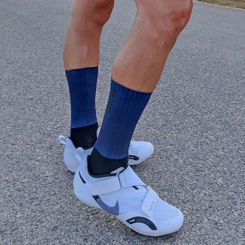 Adult unisex cycling and running socks in orange, black, purple, white, grey, and dark blue colours