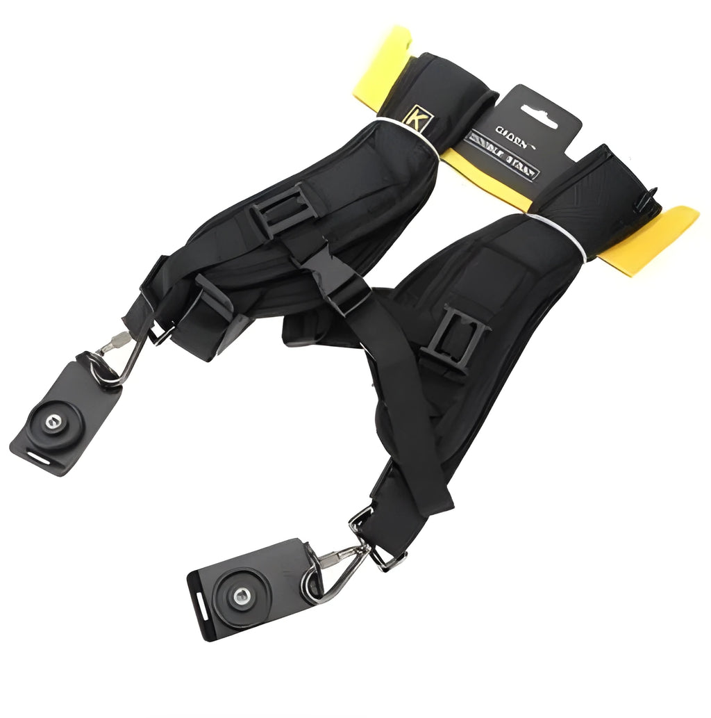 Black professional dual SLR camera shoulder strap shown carrying two cameras.