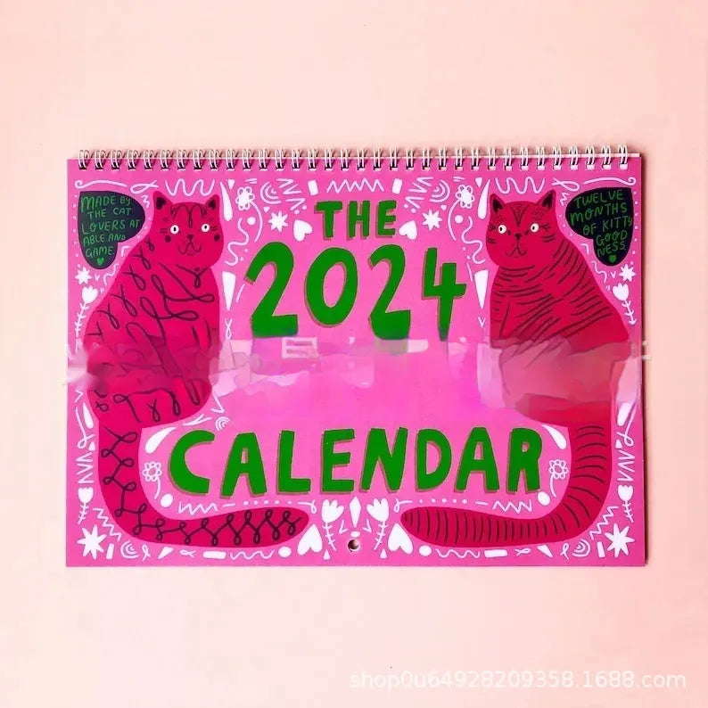 Cat calendar wall planner showing daily tear-off sheets with feline imagery