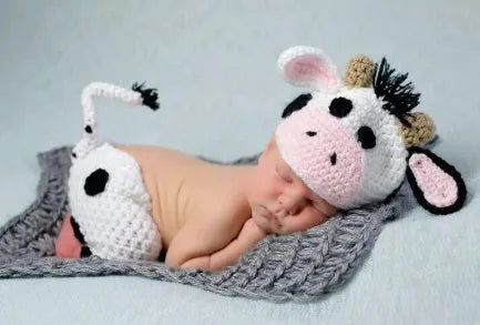 White hand knitted baby cow suit with hat and pants in wool and cotton