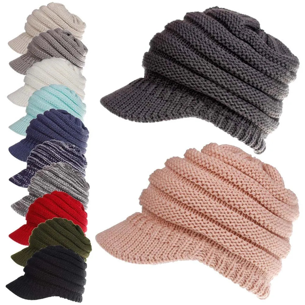 Woman wearing a thick knitted beanie with her ponytail pulled through the hole in the crown.