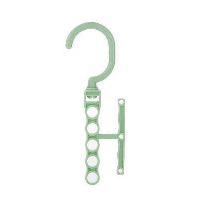 Magic revolving wardrobe hanger with five holes and handle in blue, green, or pink for clothes organisation