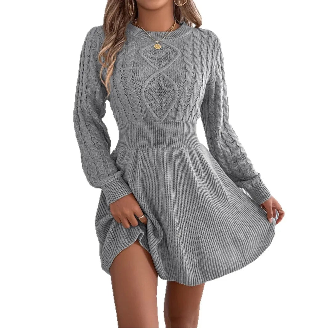 A solid colour long sleeve sweater dress with lantern sleeves and an elastic waist, shown in black.