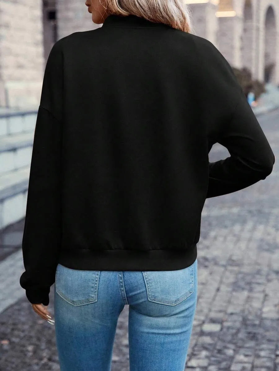Black women's casual zip jacket with long sleeves and faux pocket detail
