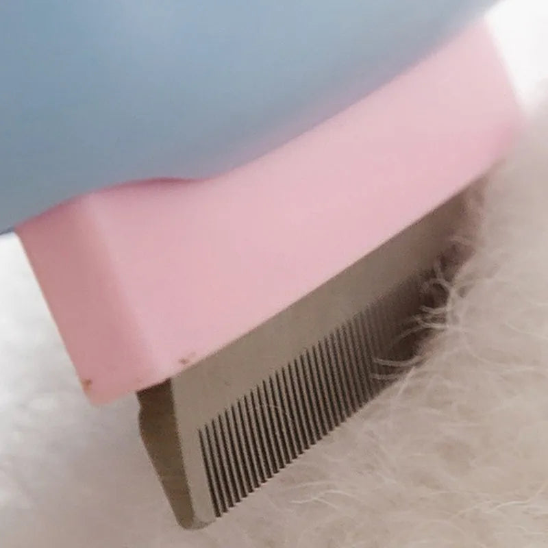 Blue and green pet grooming brush with a double-sided head for deshedding and dematting.