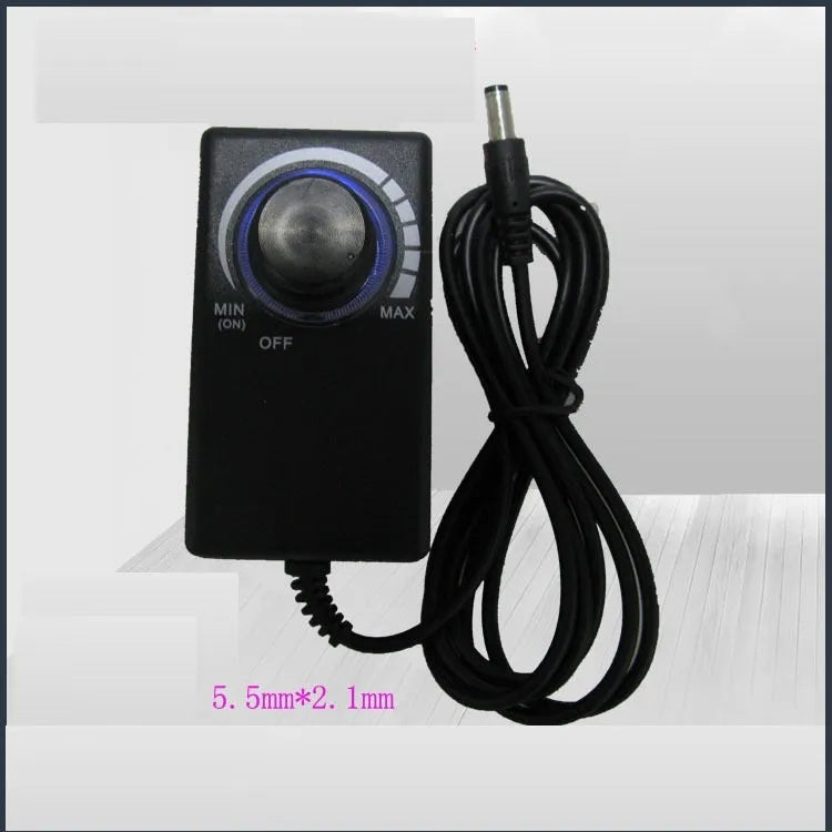 Compact black adjustable power adapter with LED digital display showing voltage output on a white background