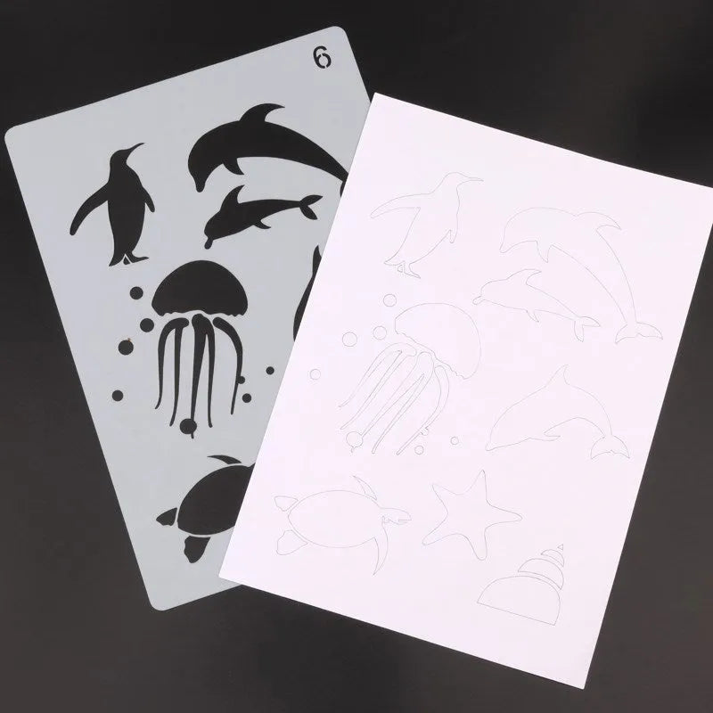 White plastic drawing stencil set with cut-out patterns for craft tracing.