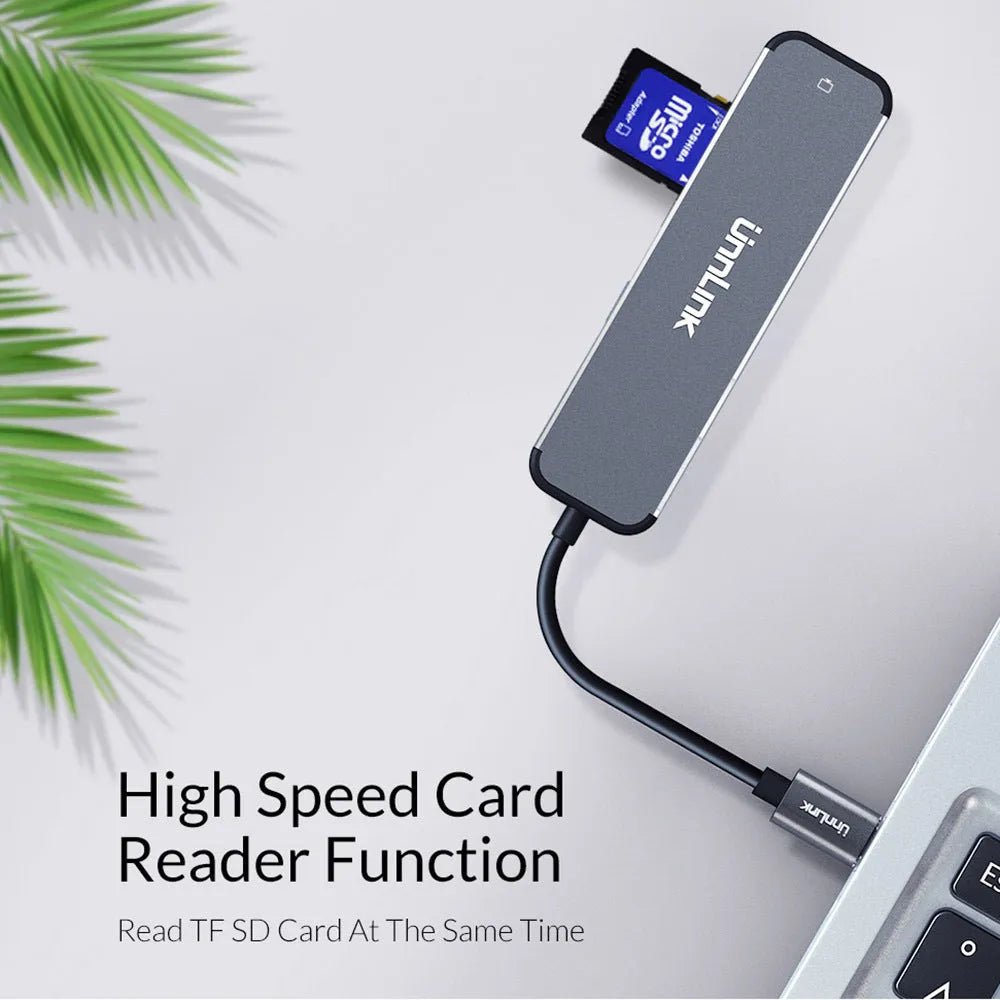 Aluminium alloy type-C docking station with HDMI, SD/TF, and USB 3.0 ports in silver colour