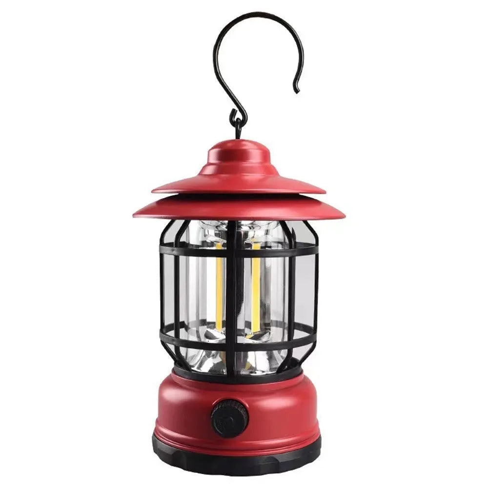 Dark green portable LED camping lantern with head strap, shown on a table with dimensions 16.6cm high.