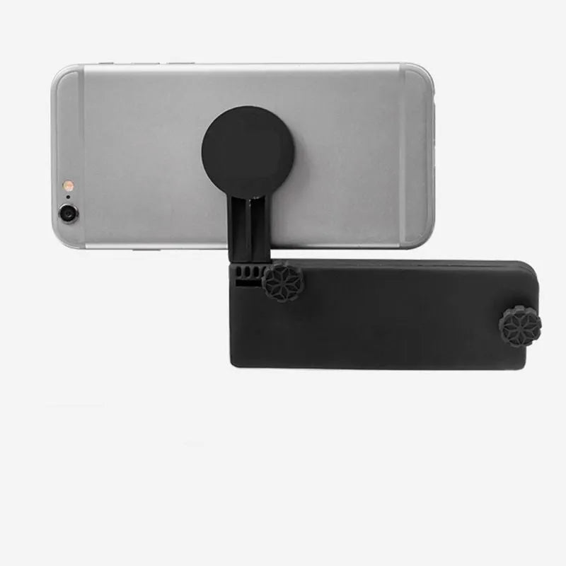 Black silicone phone holder stand clipped to a laptop, holding a mobile phone for multi-screen use, 11x10x1cm.