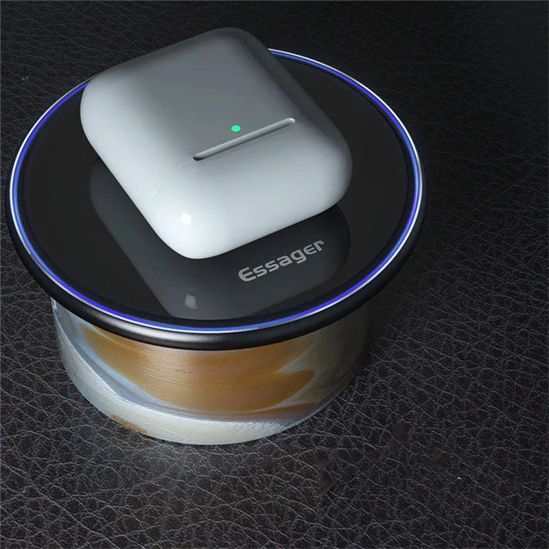 Black Qi fast wireless charging pad for smartphones on a desk