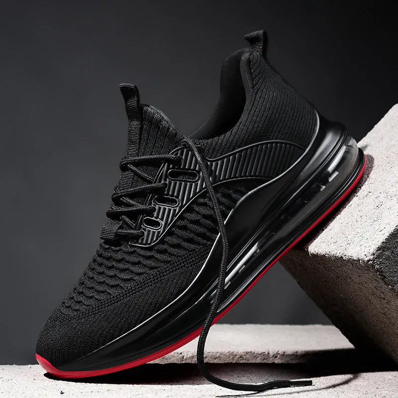 Men's black low-top mesh running shoe with lace-up front and rubber sole.