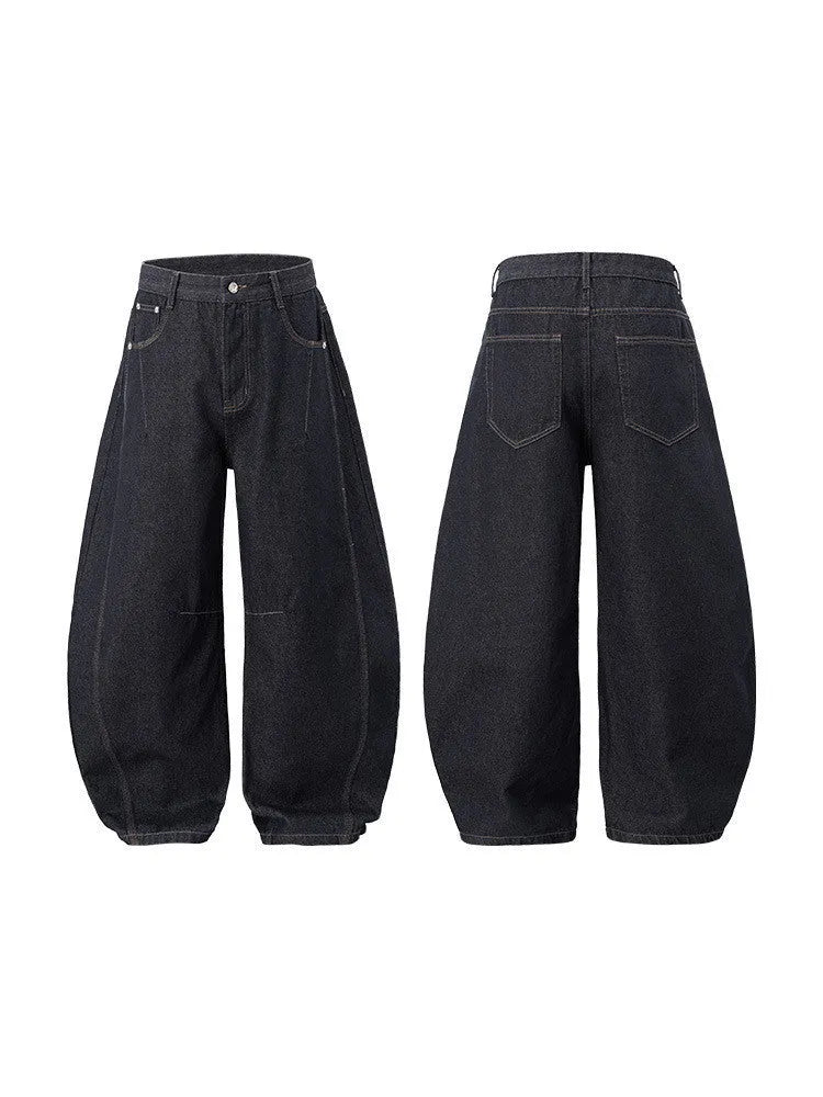 Men's original cow colour wide leg denim trousers laid flat, showing mid waist and straight leg cut.
