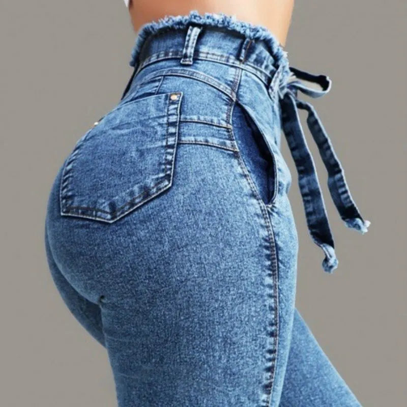 Fringed jeans in cowboy fabric showing fringe detailing, available in dark blue, grey, and light blue colours