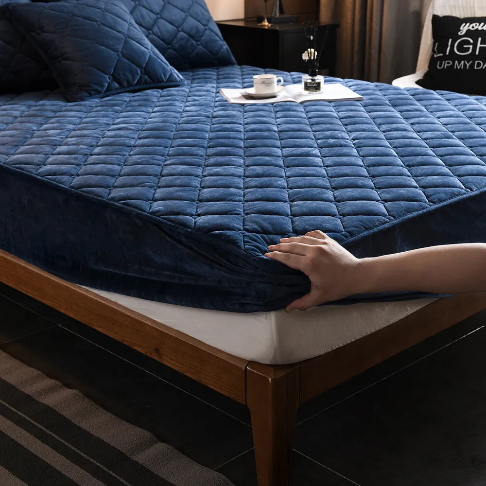 Crystal fleece padded bed cover in grey with quilted stitching and matching pillow case