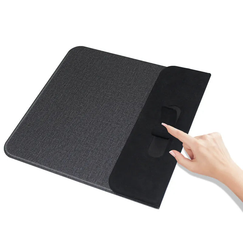 Black 2-in-1 wireless charging mouse pad with non-slip base and phone stand on a desk