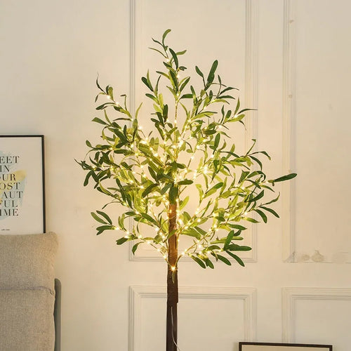 Tall 1.8 metre simulation olive leaf tree lamp with warm white LEDs lit, showing abstract trunk design.