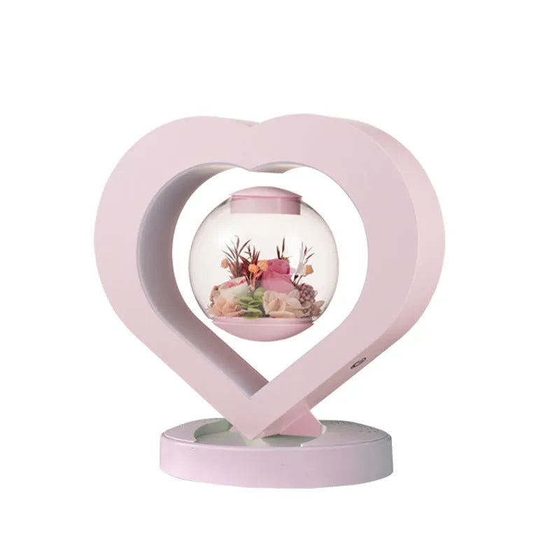 Pink preserved rose ornament with optional base and audio Bluetooth functionality for gift giving
