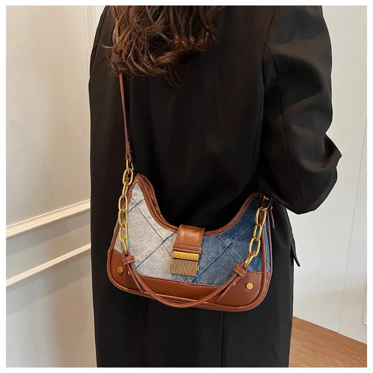 Brown denim women's bucket shoulder bag with diamond chain straps and lock detail
