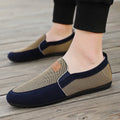 Men's grey canvas board shoes with round toe and rubber sole on a white background.