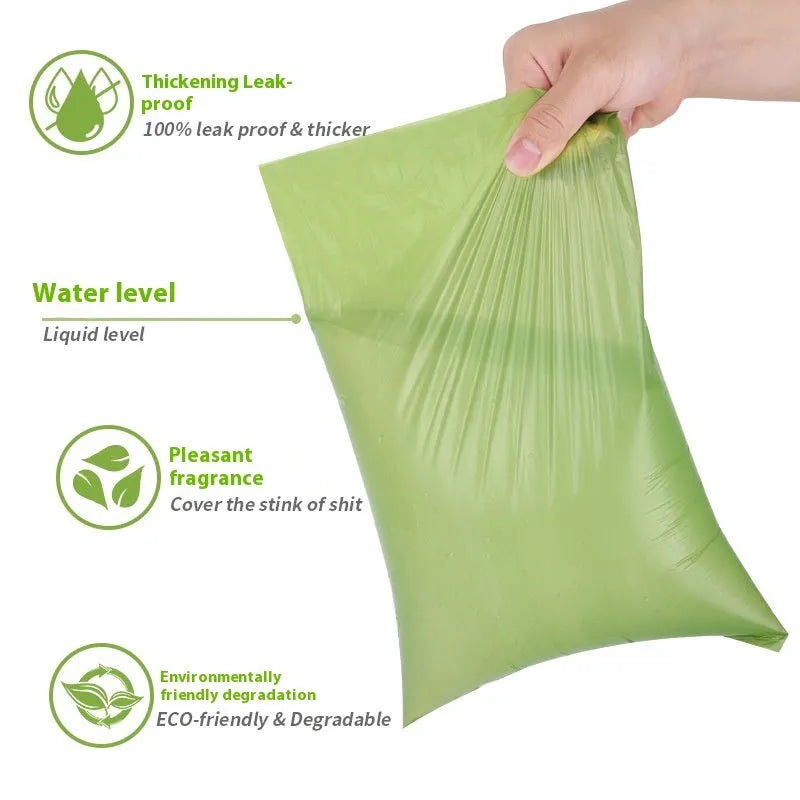 Green EPI degradable pet waste bags on a roll next to a white dispenser.