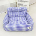 Grey and blue plaid portable dog car travel nest with stain-resistant cloth fabric.