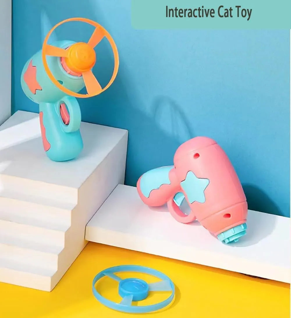 Blue plastic cat toy gun with disc launcher and Frisbee for indoor feline play