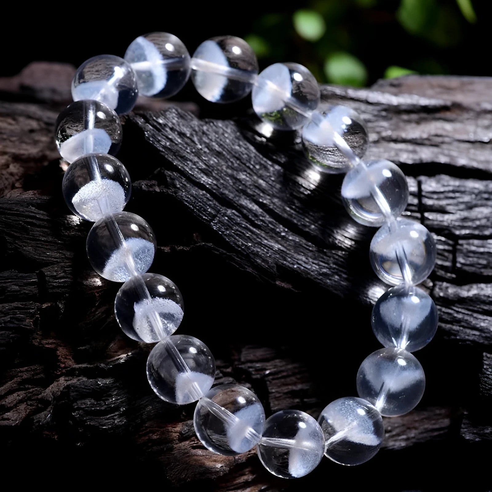 Women's adjustable white crystal ghost pyramid bracelet with Ruyi charm on wrist.