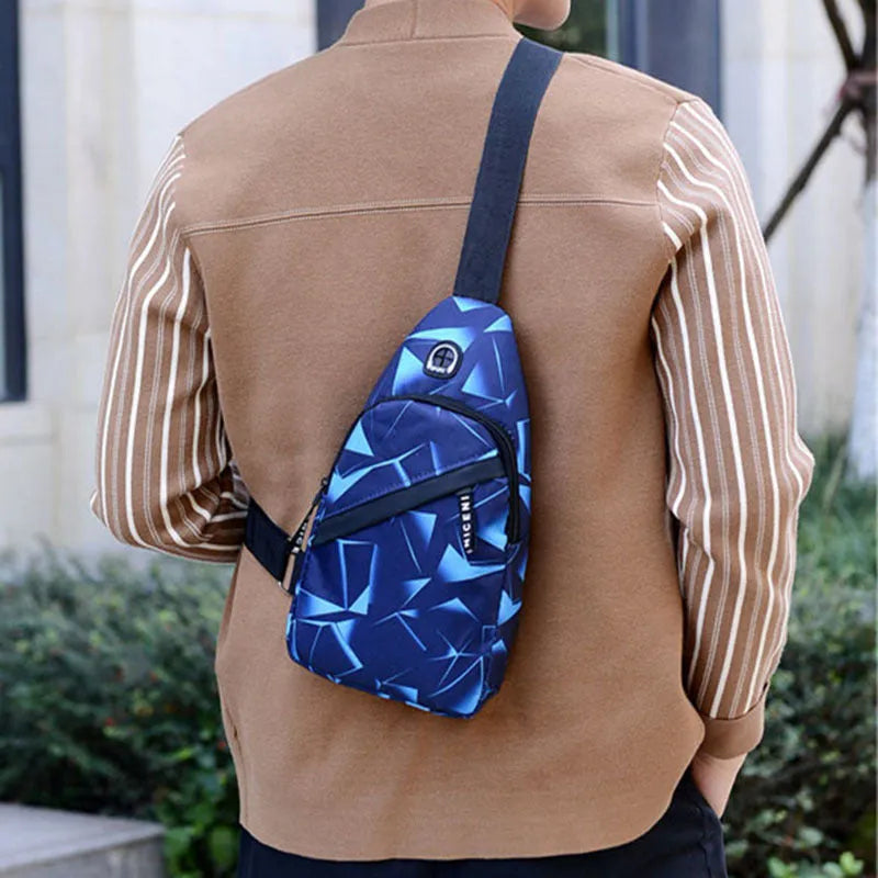 Blue Oxford cloth sling bag with a crossbody strap, earphone hole, and zipper pocket.
