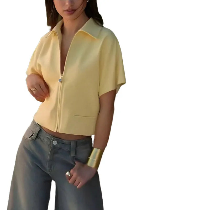 Loose-fit short sleeve casual top in white, shown on a model.