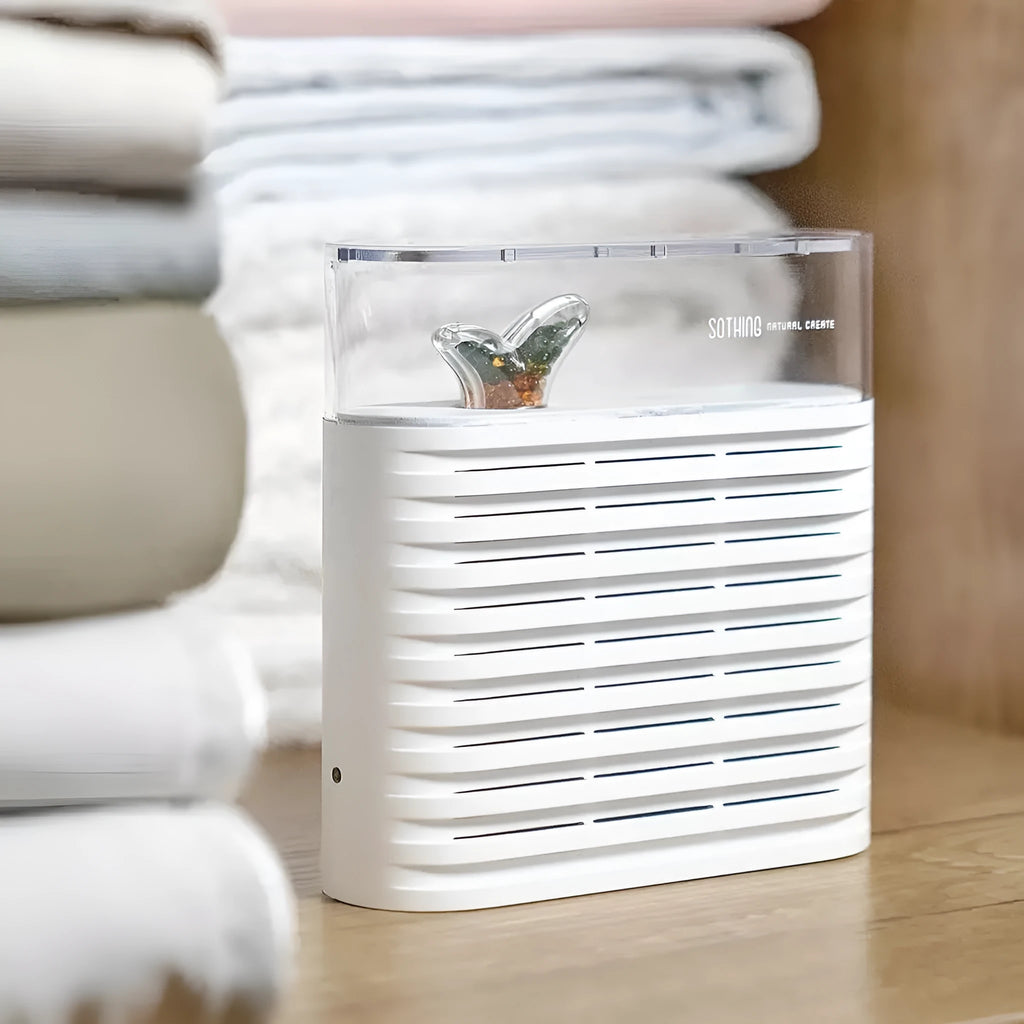 White recyclable cabinet dehumidifier box with transparent lid showing colour-changing silica gel beads.