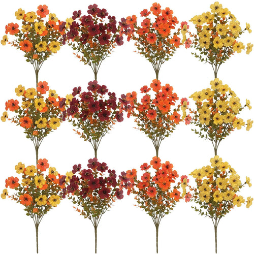 Artificial flower bouquet in autumn orange, yellow, and red colours with detailed plastic and silk construction