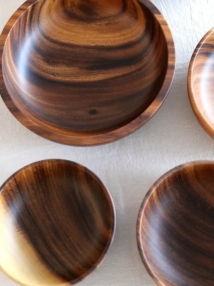 Brown handmade wooden bowl with natural wood grain and overglaze finish