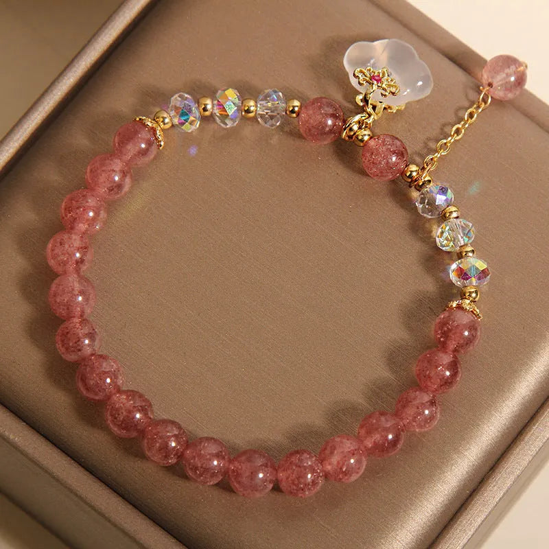 Women's natural bracelet with strawberry quartz, white agate beads, and auspicious cloud charms