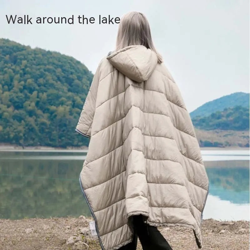 Outdoor cloak sleeping bag in grey laid out flat showing its 200x140cm rectangular shape.