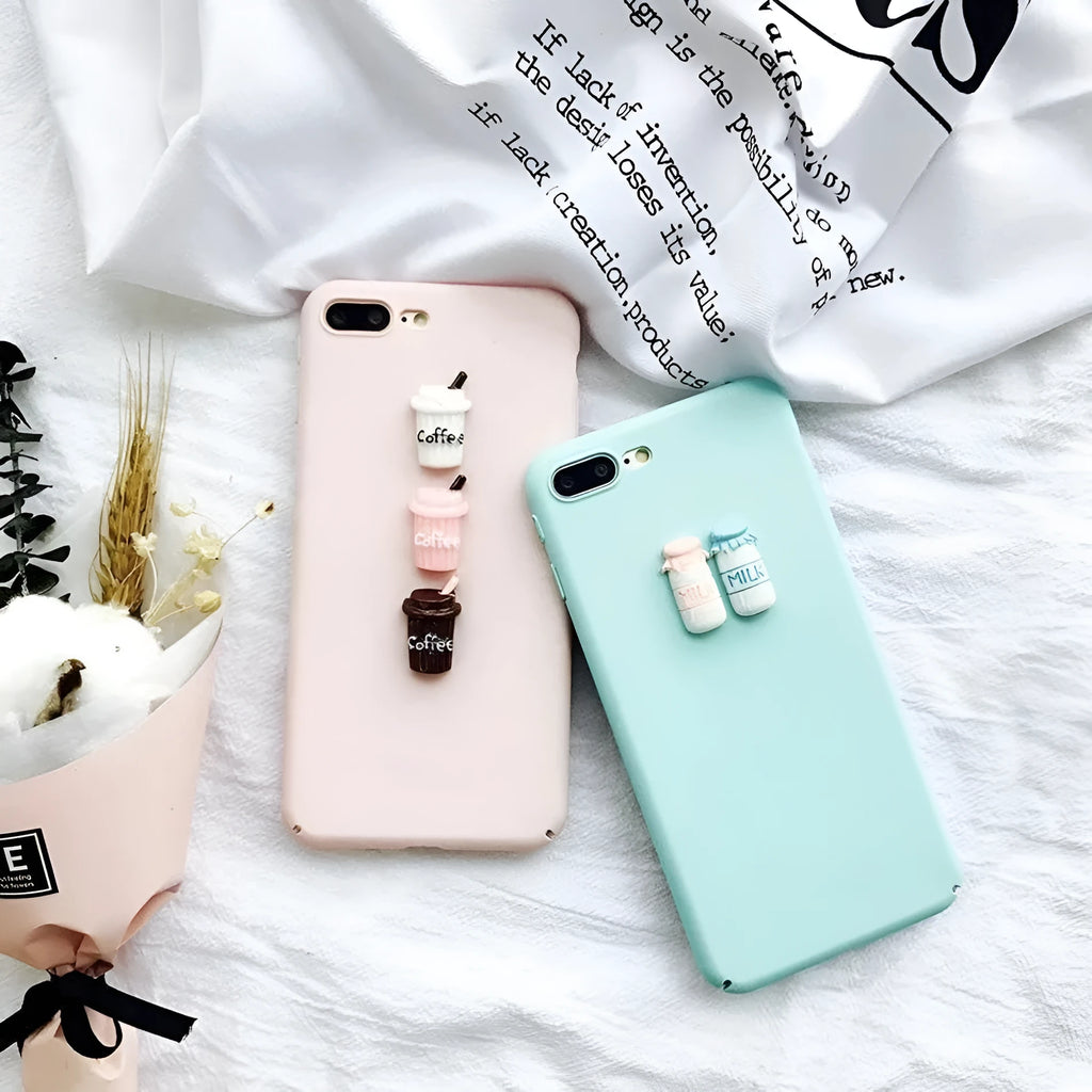 A soft pink silicone iPhone case with a raised 3D cartoon cat design on the back.