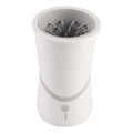 White pet electric foot washer with ABS plastic cylindrical body standing on paws